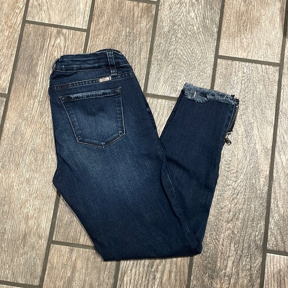 Kancan size 9/29 dark wash skinny Jean with frayed zipper hem.
